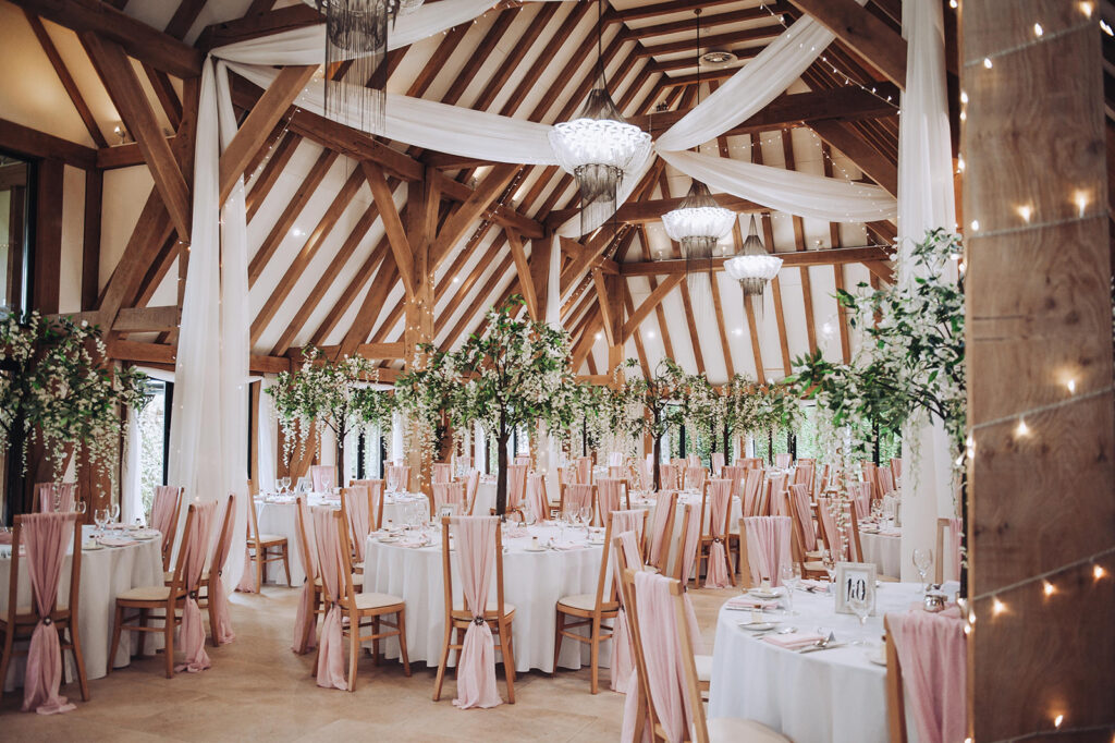 Empty reception area all set up ready for a wedding at The Old Kent Barn