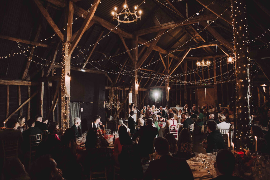 A photograph of the bride giving a speech at Manor Barn wedding venue in Cambridge.