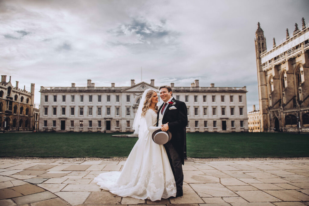 Couple embracing in front of Kings College in Cambridge