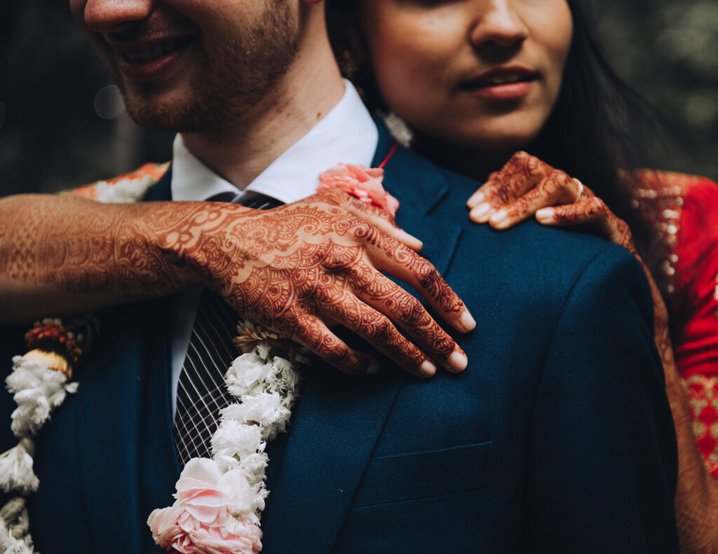 Couple embracing at their luxury Indian wedding