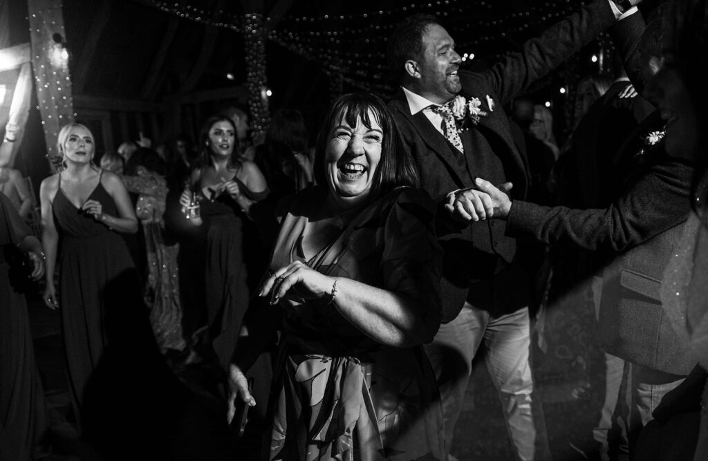 mother of the groom and groom partying at their wedding