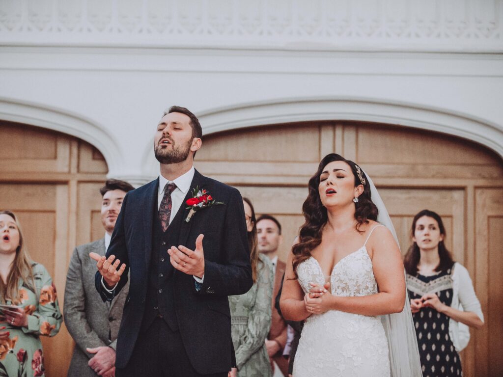 Christian wedding in Cambridge while the bride and groom worship