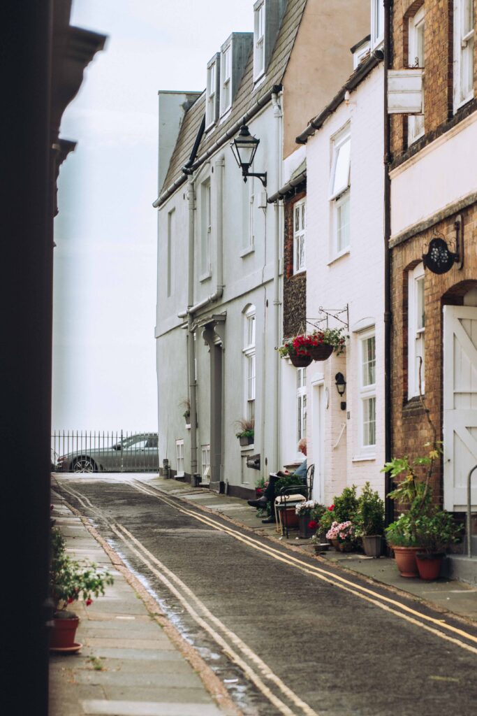 Old retired man outside his house down Middle Street in Deal