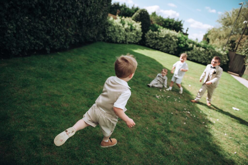 Kids playing at a wedding at the Old Kent Barn