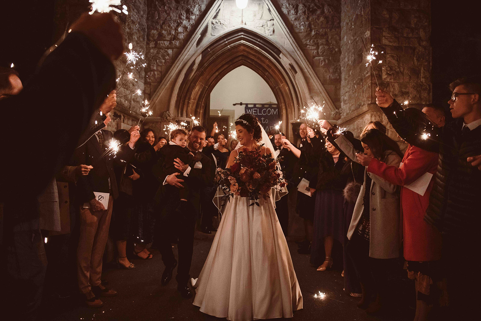 Sparklers with bad weather at a winter wedding in Deal Kent