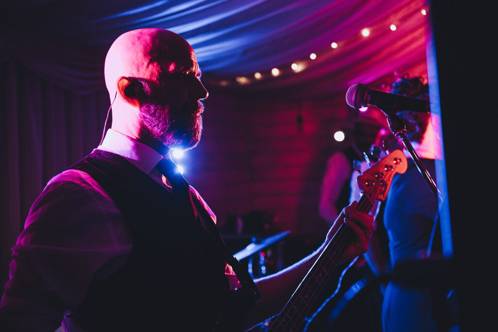 Bassist in the spotlight at a wedding
