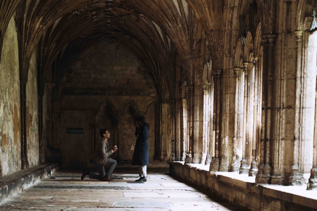 Indian man on one knee getting engaged