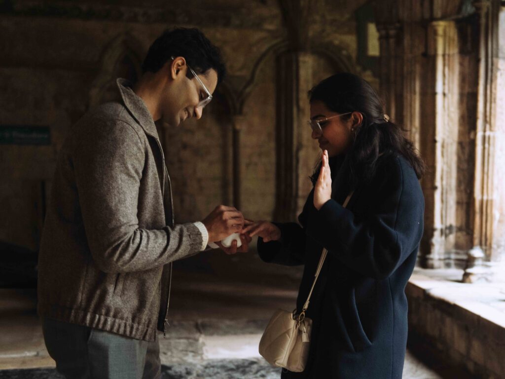 A Gen Z Indian couple getting engaged over Christmas at Canterbury Cathedral