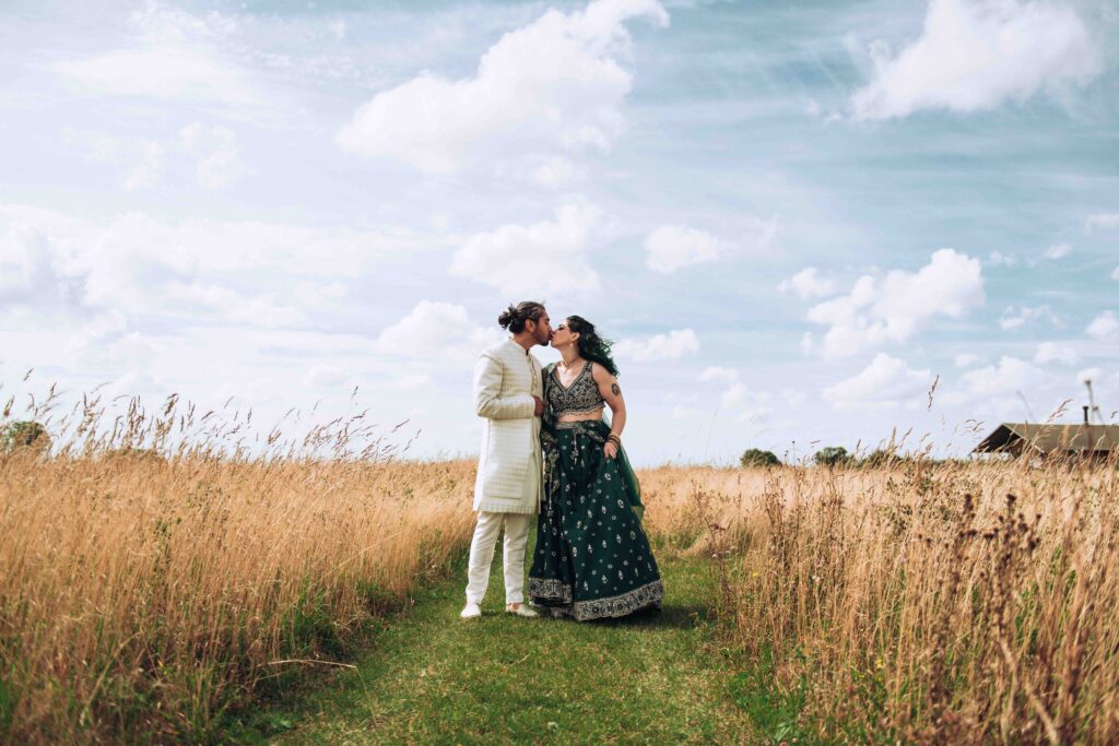 Vegan couple kissing at their wedding at Hempsall Farm in Cambridge giving advice on hiring a vegan wedding photographer