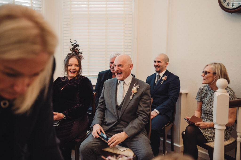Father of the bride laughing