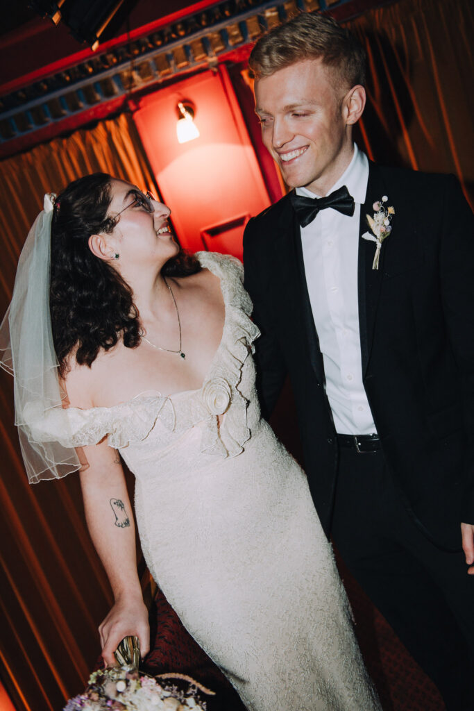 Bride stood in the Palace Cinema in Broadstairs smiling at each other