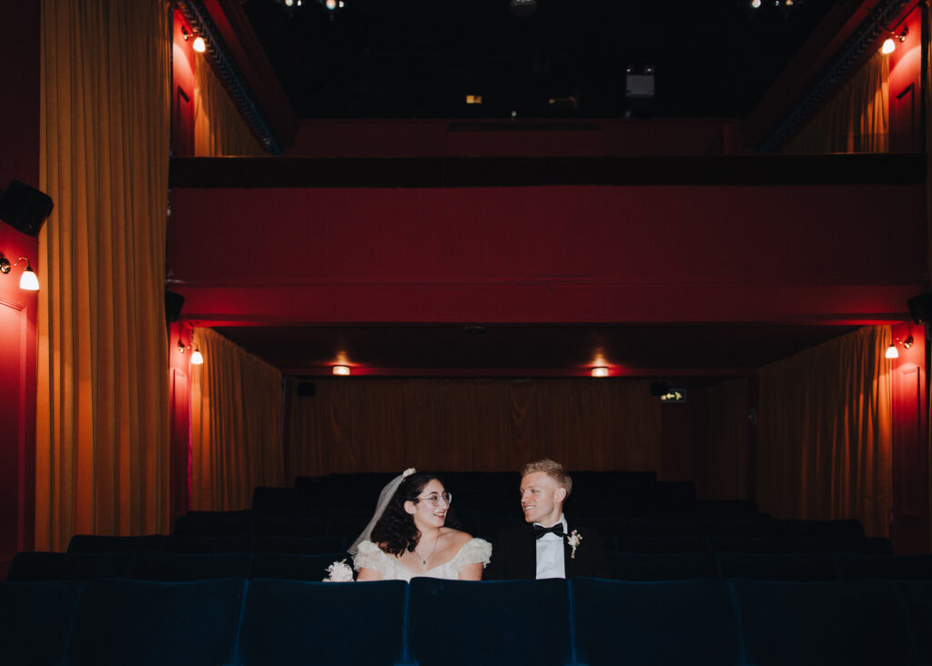Bride and groom sat in chairs in the Palace Cinema in Broadstairs