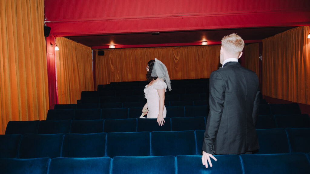 Bride and groom finding their seats in the Palace Cinema in Broadstairs