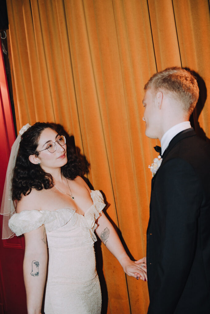 Bride and groom standing together in the Palace Cinema in Broadstairs