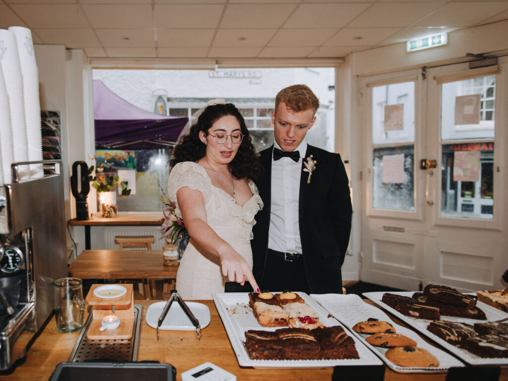Bride and groom picking cakes in Giant Coffee in Broadstairs