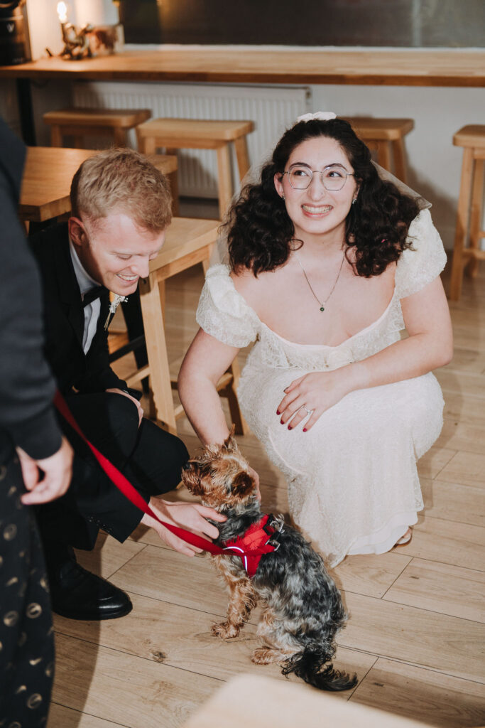 Bride petting a dog in Giant Coffee in Broadstairs