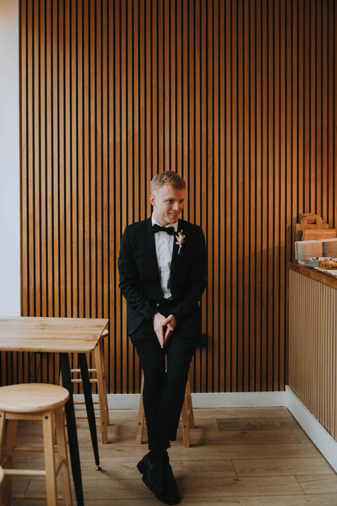 Groom sat in a chair in Giant Coffee in Broadstairs