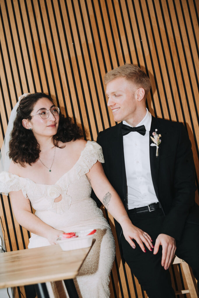 Bride and groom sat in a chair in Giant Coffee in Broadstairs