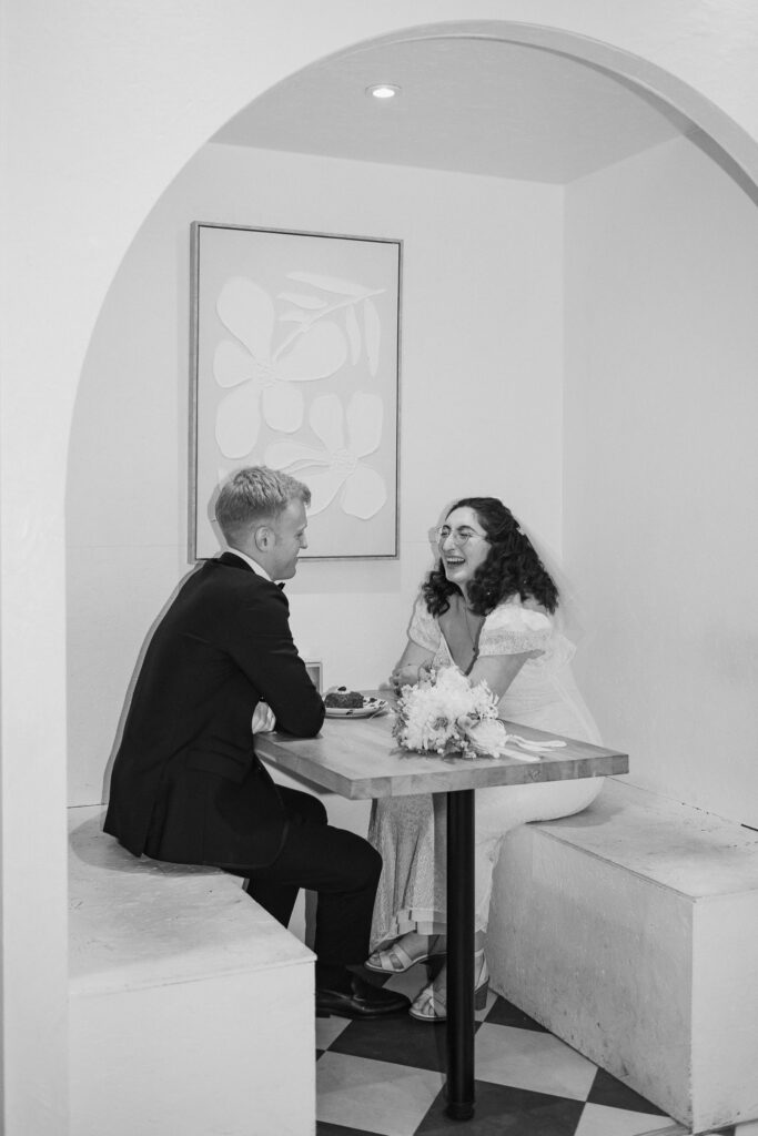 Bride and groom sat in a chair in Giant Coffee in Broadstairs