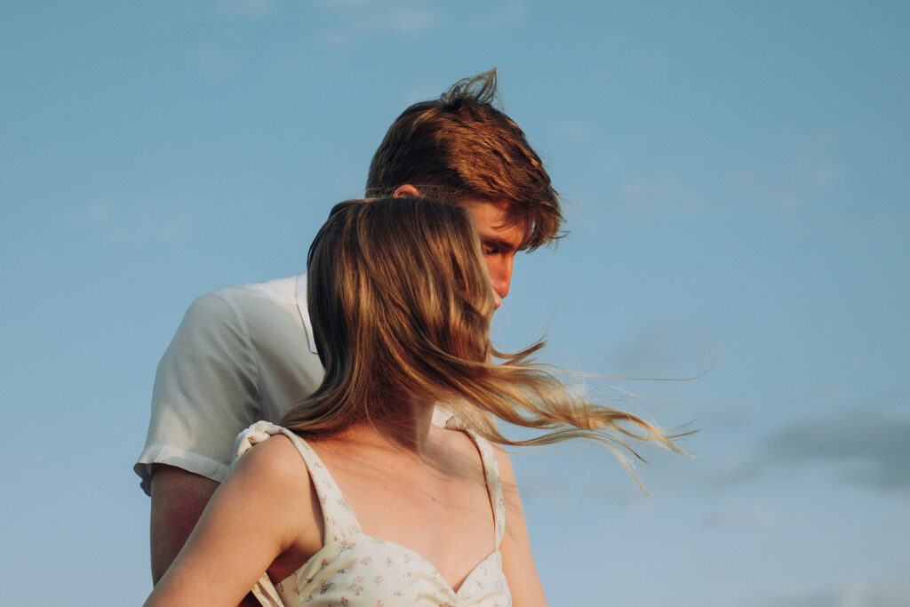 Newly engaged couple hugging in one of the best engagement shoot locations in Thanet Kent