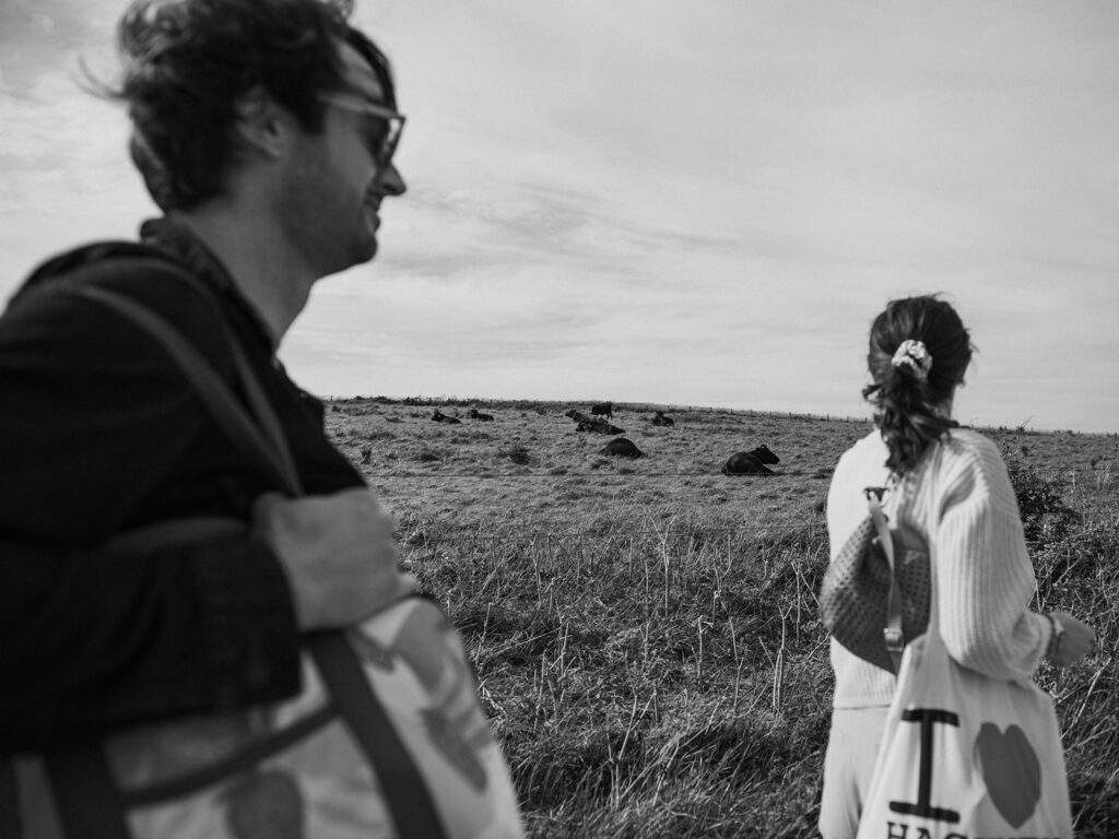 Newly engaged sat by Joss Bay fields