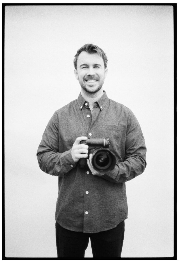 Tom Keenan the port lympne wedding photographer holding his film camera