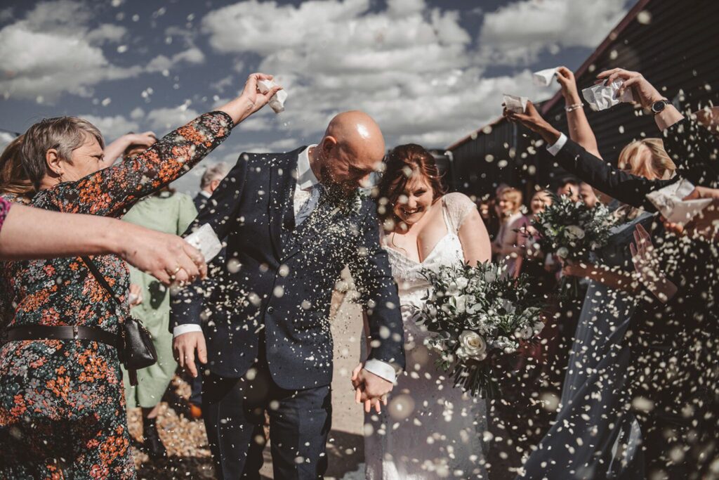 Windy confetti shots at East Quay wedding venue