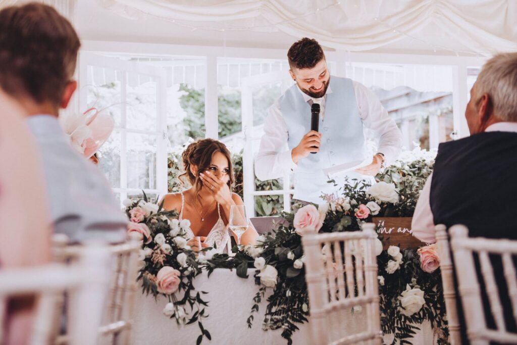 Why choose documentary wedding photography for your big day? For photographs like this bride laughing at the grooms speech.