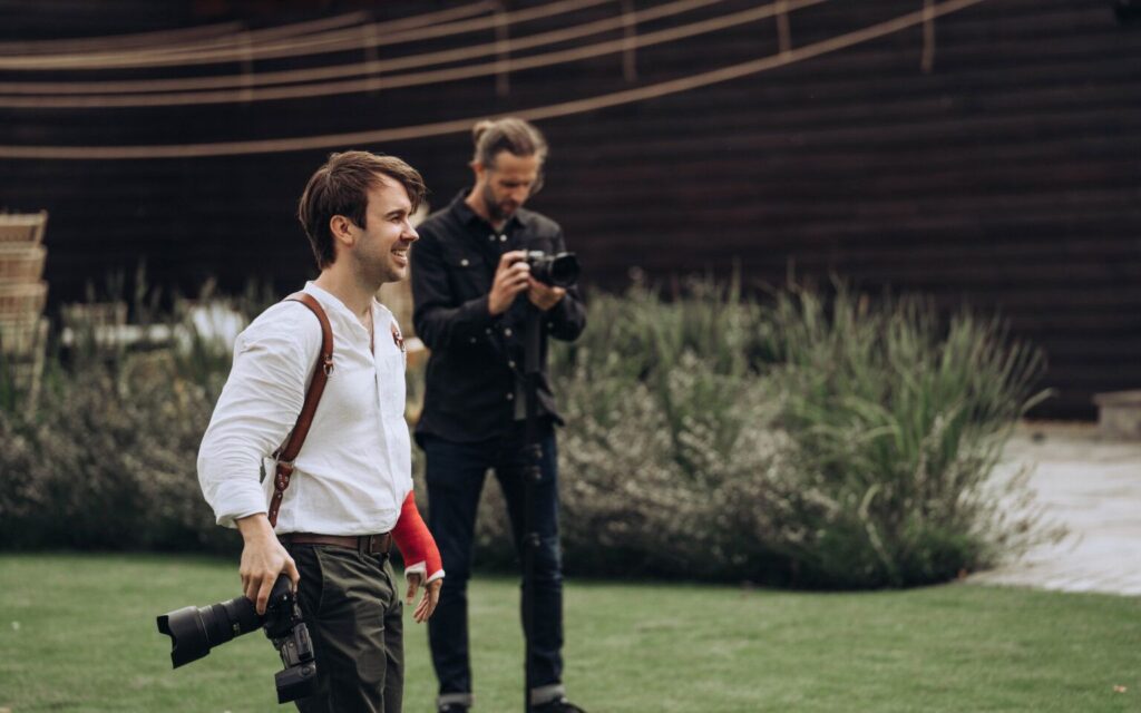 Tom Keenan the photographer with broken arm and second shooter in background