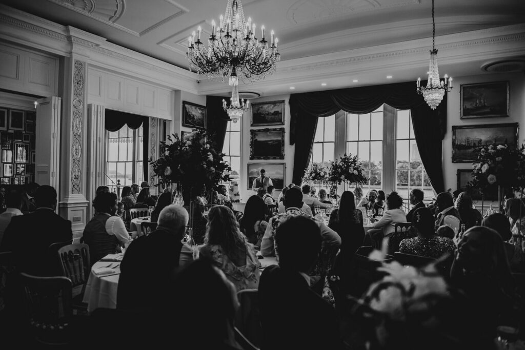 Some best man tips during a speech under luxury chandeliers in front of wedding guests at the Trafalgar Tavern wedding venue in London