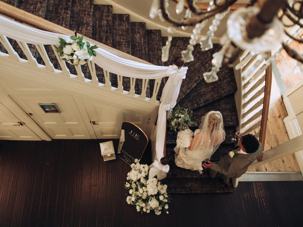 bride and groom walking upstairs