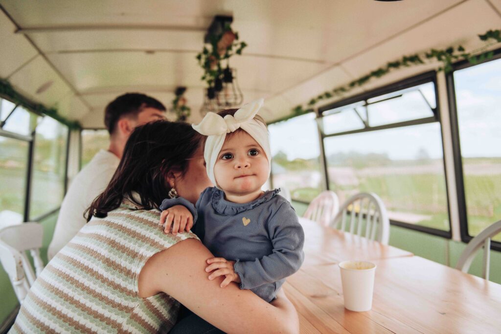Baby being cuddled at wedding