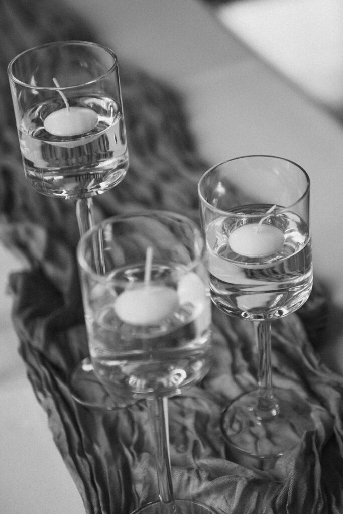 candles in glasses on a table