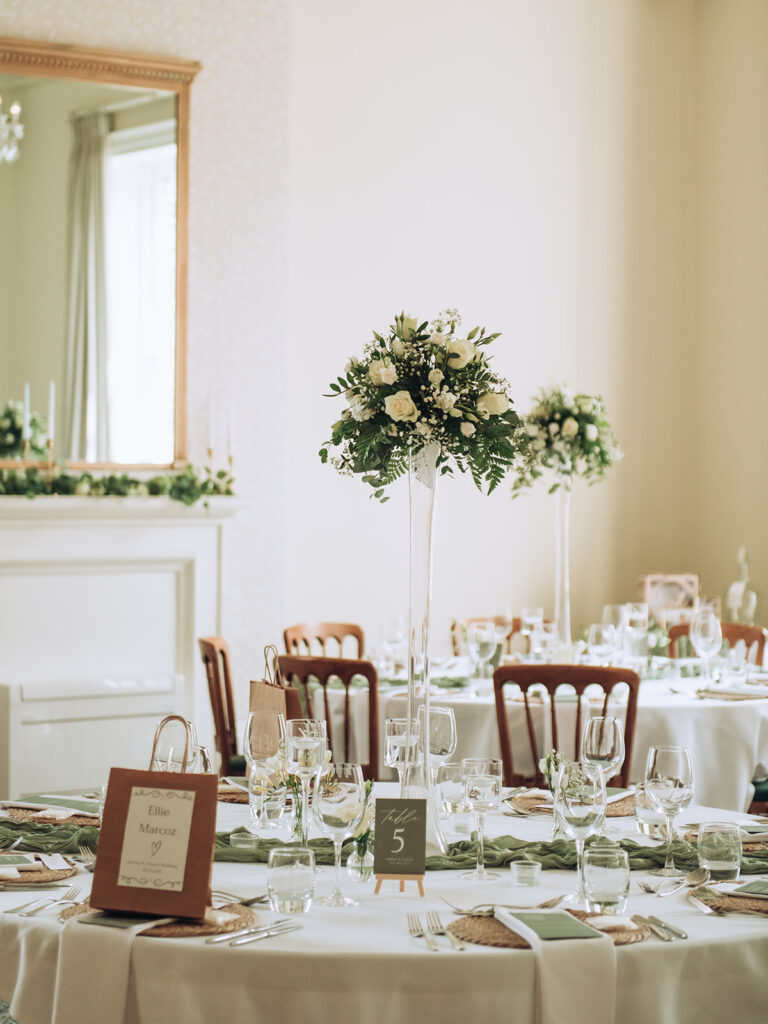 wedding reception tables at the bell hotel with flowers in the middle
