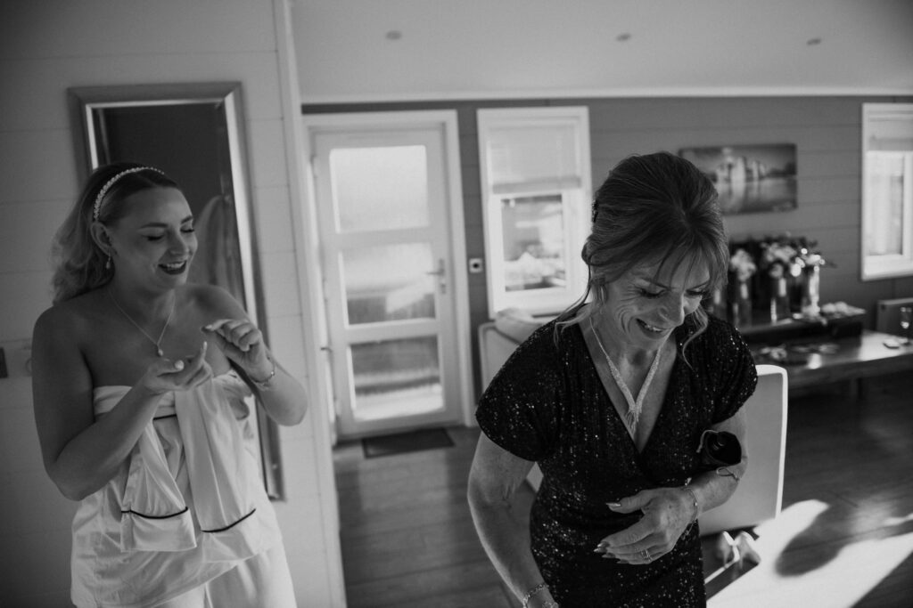 Bride and mother laughing