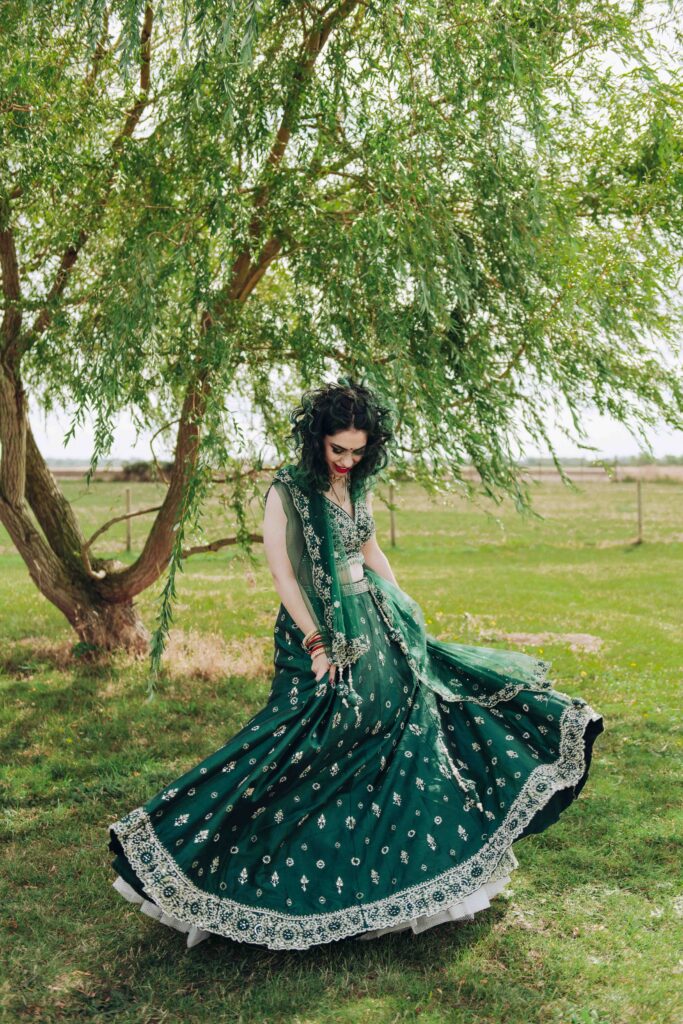 Bride dancing under a tree