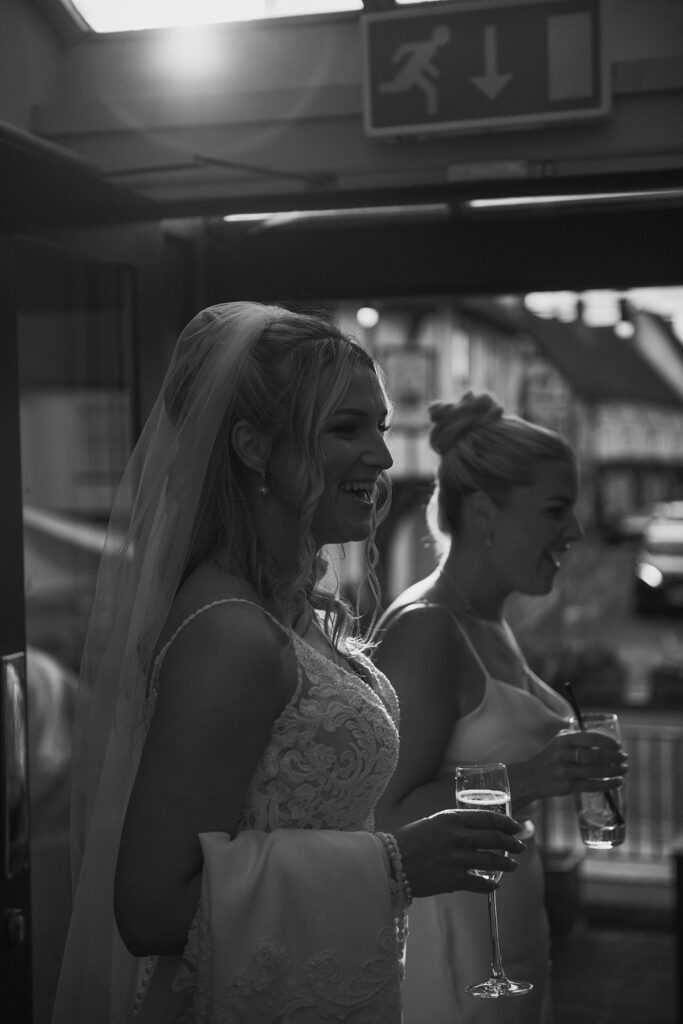 Bride laughing during sunset at wedding