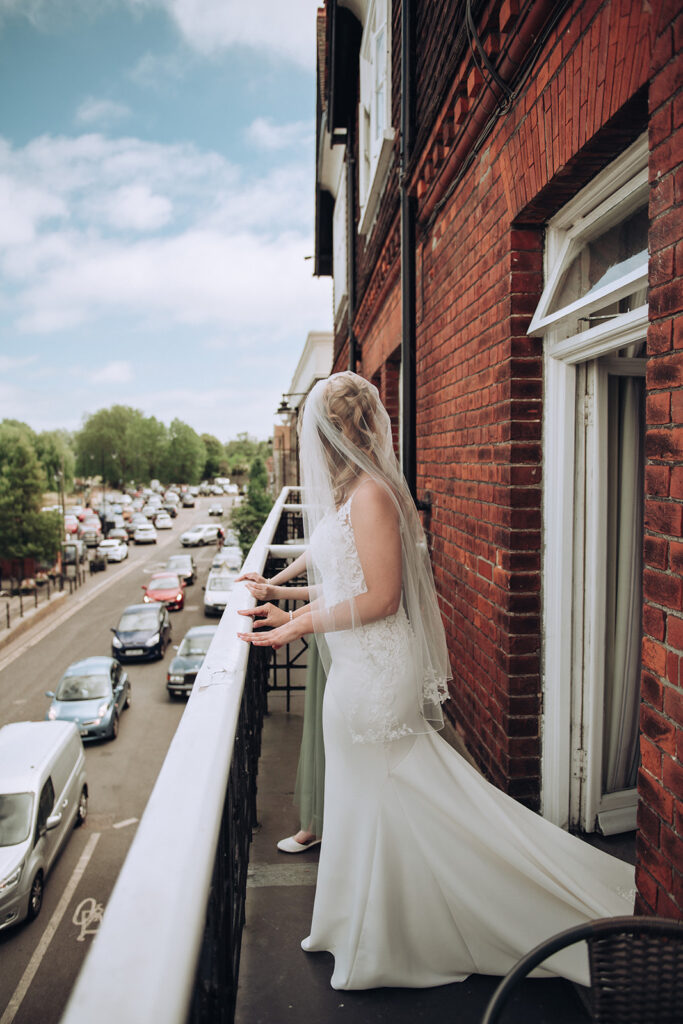 bride looking out over balcony