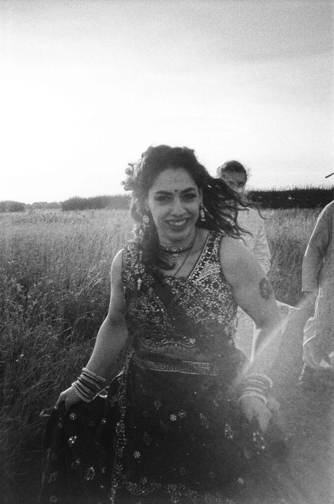 Analogue film scan of indian bride in field
