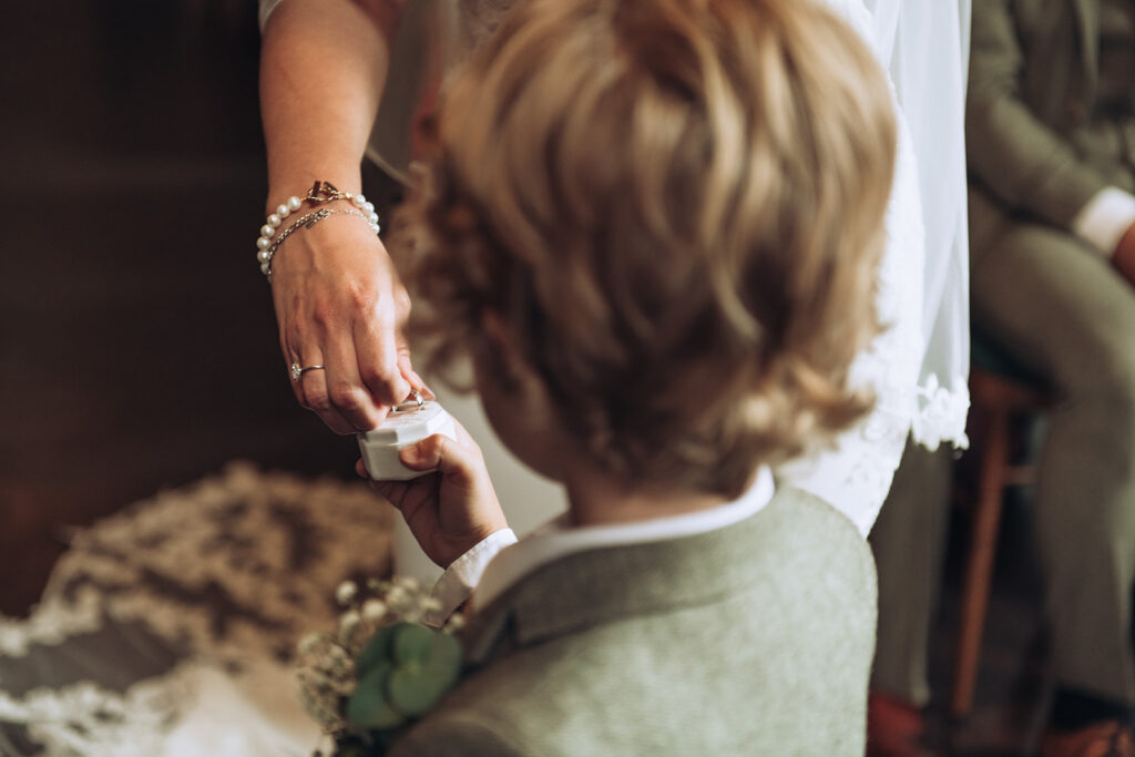 Child giving wedding rings