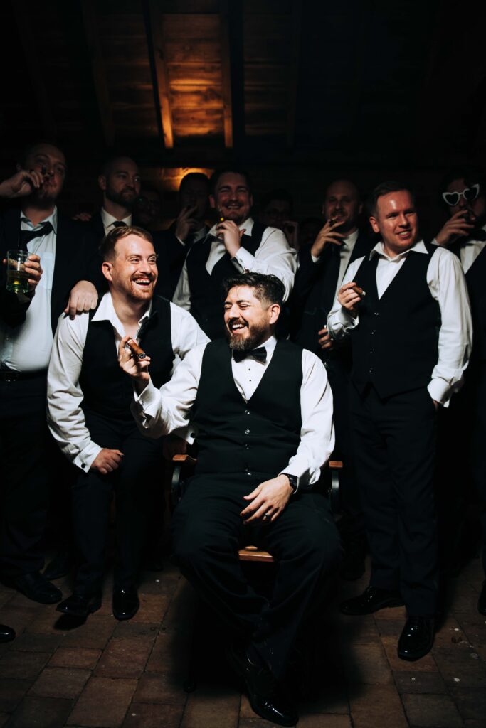 groom with groomsmen and cigars