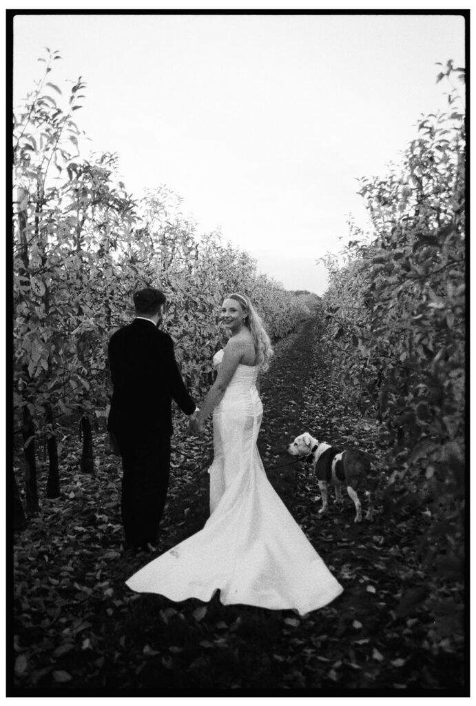 Bride and groom walking at wedding outside