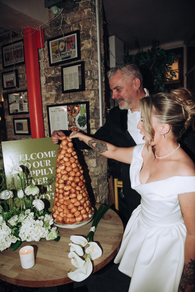 Bride and groom cutting cake