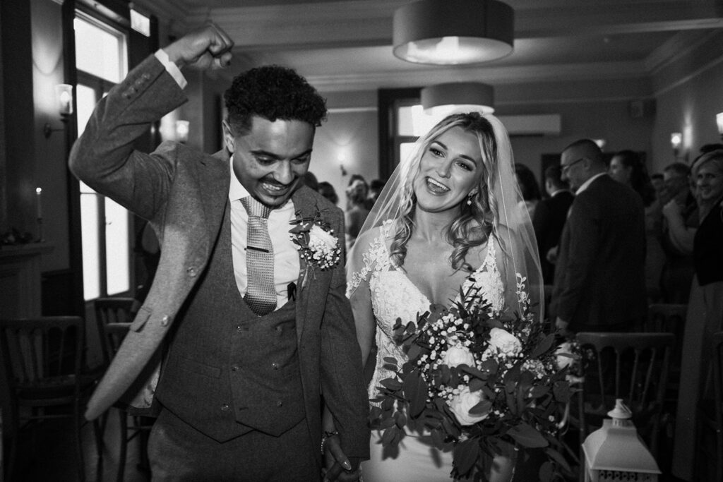 Bride and groom walking out of wedding ceremony