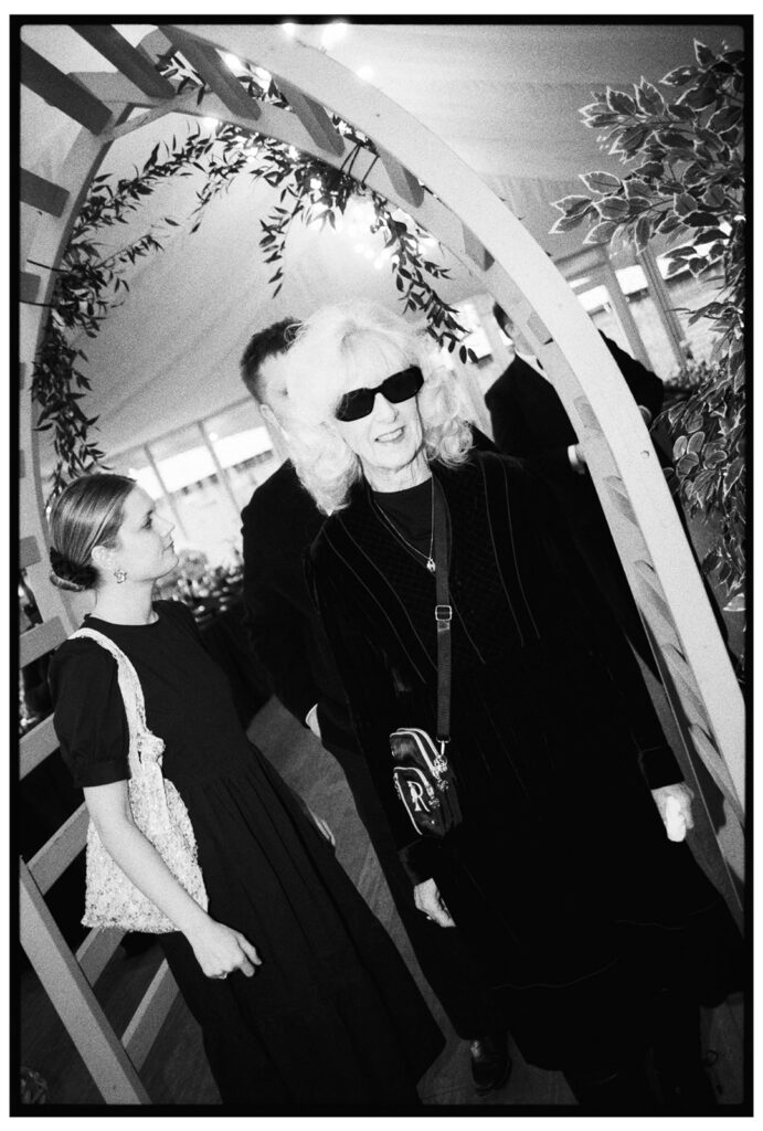 Direct flash portrait of a lady in sunglasses
