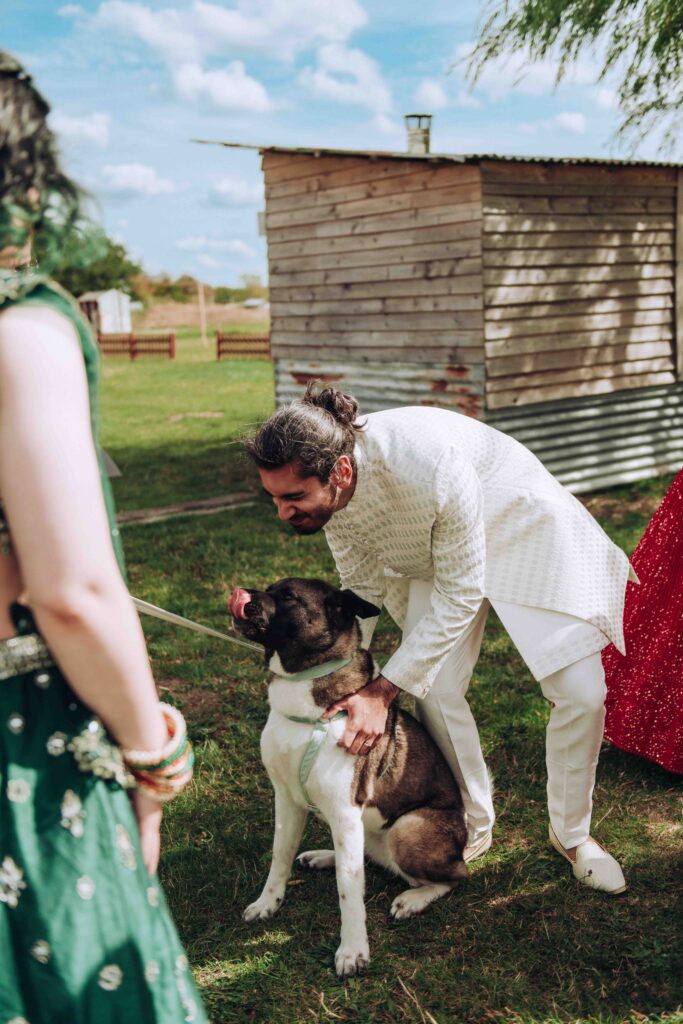 Groom being licked by dog