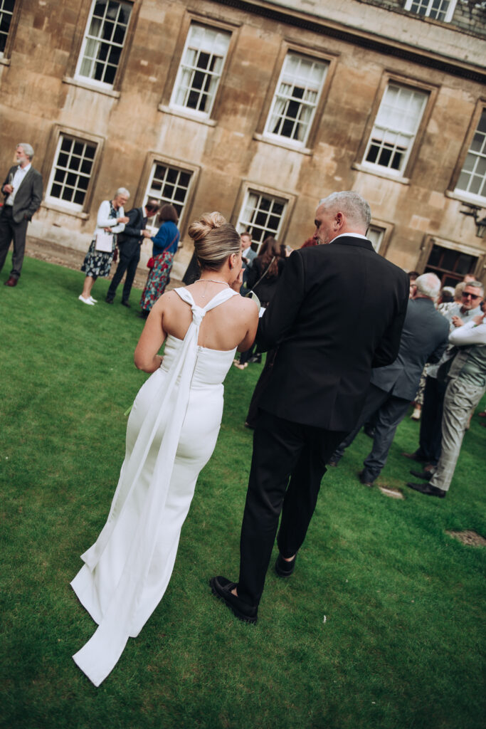 bride and groom greeting wedding guests