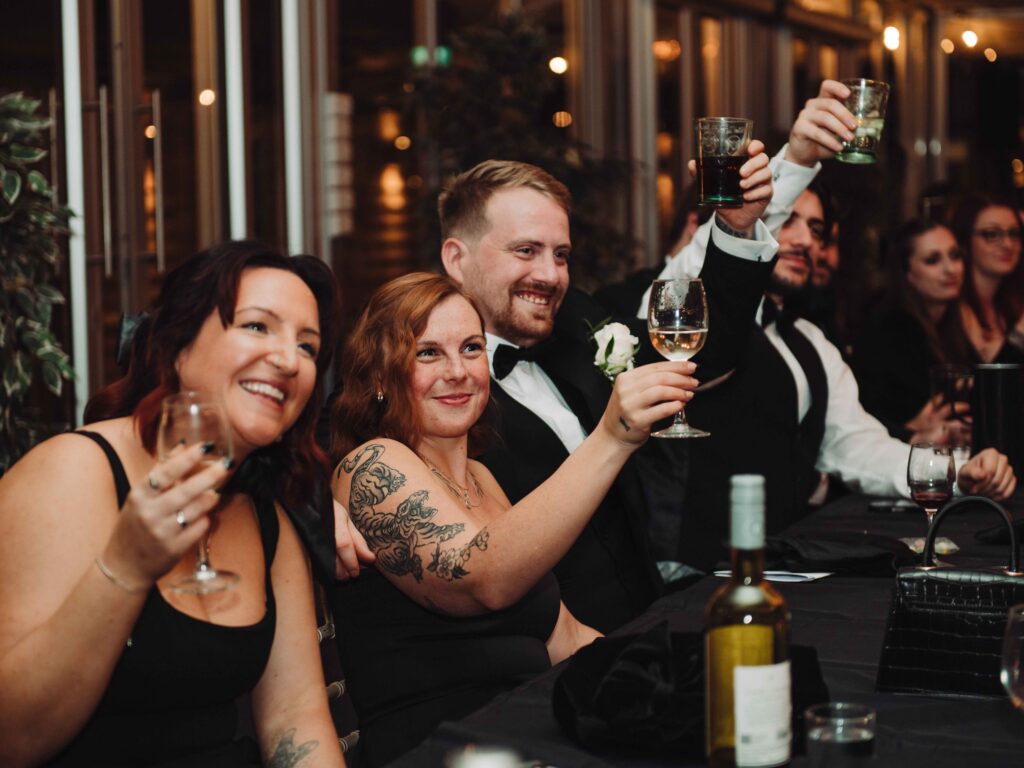 wedding guests toasting