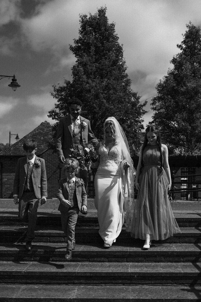 Family walking down steps by the quay in Sandwich