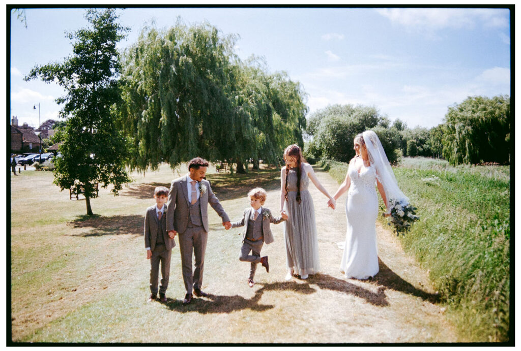35mm analogue film scan of family walking by the quay in Sandwich